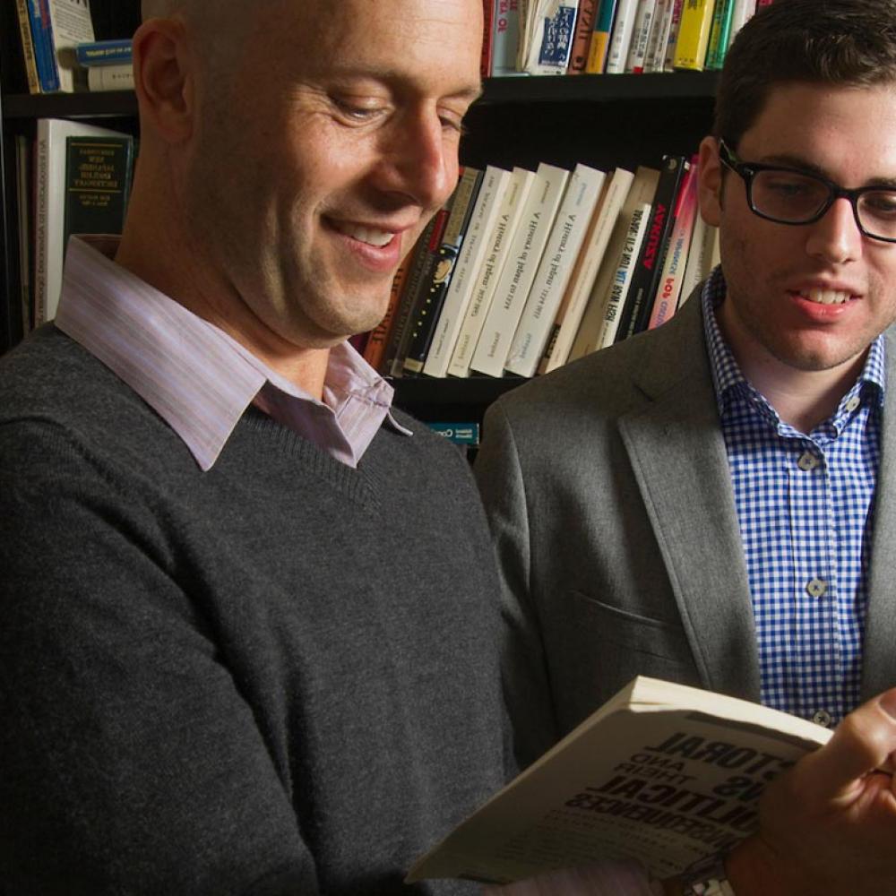 A student and a professor discuss a political science book